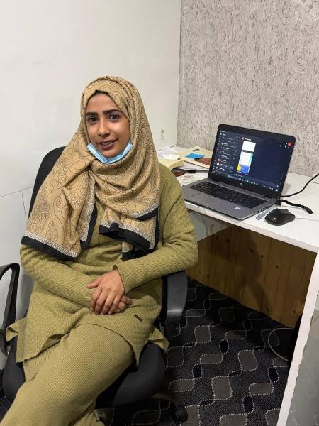 Support staff assisting travelers during Kashmir trip