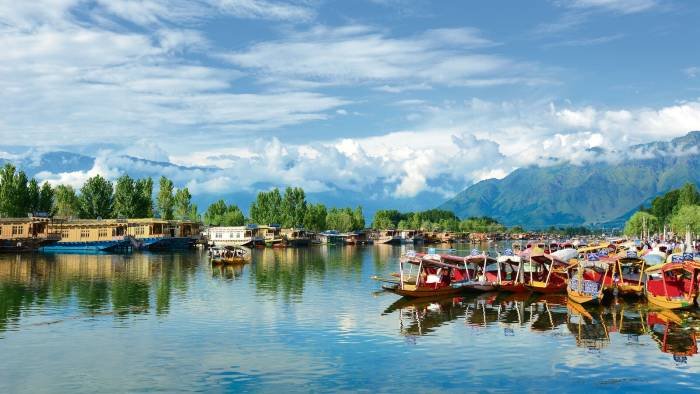 luxury family tour Kashmir Gulmarg snow mountains with kids and parents enjoying holiday