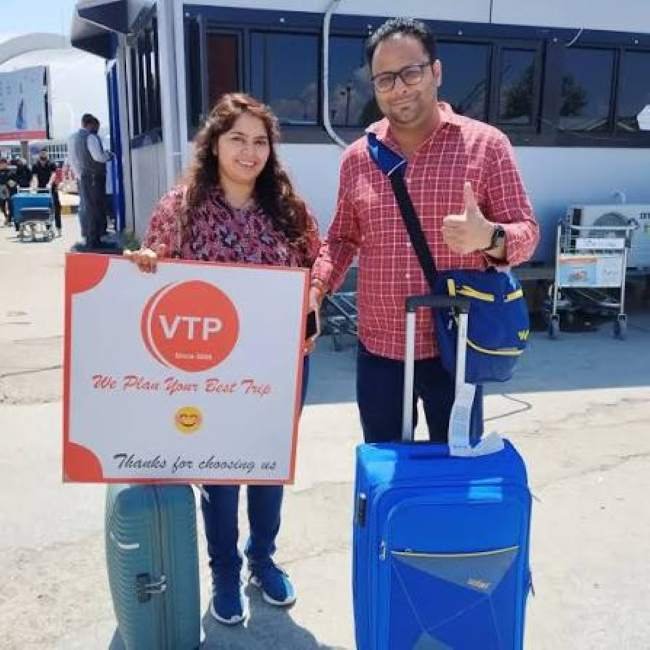Valley Trip Planner driver meeting travellers at Srinagar airport arrivals